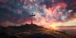 a cross on a hill with a sunset in the background and clouds in the sky