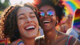 Fototapeta Uliczki - Candid happy young lesbian woman smiling celebrating gay pride LGBTQ festival