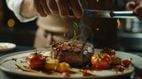 Fototapeta  - chef in restaurant Preparing beef steak with vegetable decoration