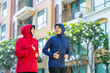 Muslim sport, Happy cheerful Asian Muslim mother and daughter practicing exercise and stretching and enjoy jogging at the park. Modern muslim woman lifestyles and diversity concept.