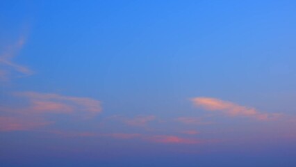 Wall Mural - The movement of clouds in a sunrise sky time lapse, where every moment brings a new display of nature's breathtaking color palette. Climate concept. Stock footage. Timelapse. Cloudscape background.
