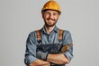 © Surachetsh - A Caucasian male construction worker, donned in uniform and helmet, smiles against a white isolated background.