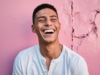 A man with a white shirt and a smile on his face