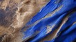 A rustic, burlap lace tableau, natural and unrefined, with bold streaks of royal blue acrylic paint adding a pop of color and a touch of the contemporary to the organic texture. 