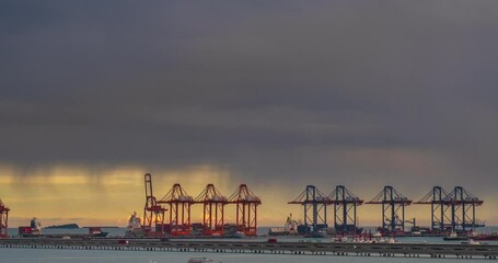 Wall Mural - Time-lapse Logistic shipping quay boat Engineering crane depot at logistic export terminal control. Warehouse freight container yard loading quayside harbor port. Multiple Exposure Motion timelapse