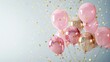 Elegant pink and gold balloons with confetti on white background.
