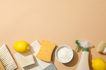 Wall Mural - Towel, brushes, sponge and ingredients for natural detergent on beige background, space for text