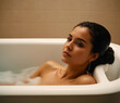 young woman relaxing in bath. naked beautiful girl in bathroom