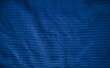 Gestreifter Stoff als Hintergrund mit blauer Farbe