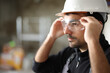 Construction worker putting protective eyeglasses