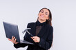 © Ivan Zelenin - Attractive woman wearing business suit with computer angry facial expression holding a hammer