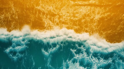 Wall Mural - Aerial view of serene coastal waves with a golden hue, creating an abstract texture