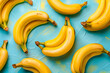 Fresh yellow bananas on bold colored blue background