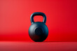 Kettlebell on red background with copy space, power lifting and fitness concept
