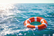 Lifebuoy floating in blue sea