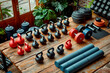 Interior of a modern fitness hall with wide assortment of dumbbells in different sizes, shapes, and colors