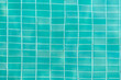 Turquoise swimming pool water surface and ripple wave background. Summer abstract reflection caustics in swimming pool.