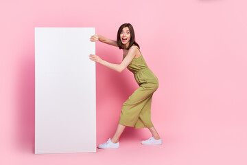 Wall Mural - Full body photo of astonished crazy lady stylish clothes hand hold mirror white panel banner empty space isolated on pink color background