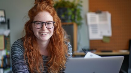 Wall Mural - Smiling Redhead Woman at Desk