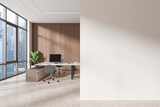 Fototapeta Przestrzenne - A modern office interior with a wooden wall, city view window, computer on desk, and empty white wall space for a mock-up. Light is natural. 3D Rendering
