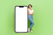 © deagreez - Full length portrait of astonished attractive person direct finger big empty space poster isolated on green color background