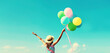 © rohappy - Happy joyful woman with bunch of colorful balloons in summer straw hat on blue sky background
