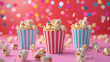 Pink and blue striped cup filled with popcorn
