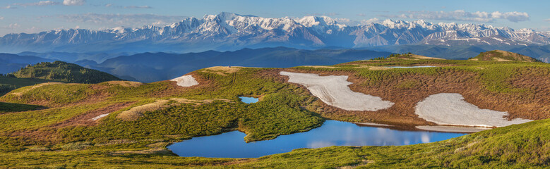 Wall Mural - Mountain landscape, small lake, snow on slopes and glaciers, panoramic view