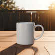 A minimalist white coffee mug mockup on a wooden table, surrounded by soft morning light, blank space for logo.
