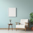 © FoxGrafy - Frame mockup in a minimalist setting, placed on a wall painted in a calming shade of light blue.