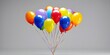 a cluster of vibrant helium balloons floating against a grey background