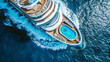 Aerial view of a large cruise ship with a vibrant blue swimming pool, sailing through the ocean.