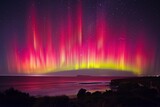 Fototapeta Tęcza - Breathtaking spectacle of the Southern Lights illuminates the night sky with vibrant hues of green, purple, and red.