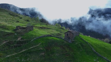 Wall Mural - Landscape of meadows, pasiegas cabins around Portillo de la Sía in the area around the town of La Gándara in the Soba Valley. Pasiegos Valleys. Cantabria. Spain. Europe