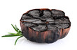 Half bulb of black garlic and rosemary isolated on white background. With clipping path.