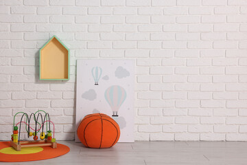 Sticker - Beautiful children's room with white brick wall and toys, space for text. Interior design