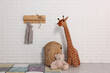 © New Africa - Beautiful children's room with white brick wall and toys. Interior design