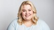 © Arceli - smiling young blonde overweight woman studio portrait on plain white background from Generative AI