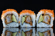 Three sushi rolls. Sushi ura with reflection. Traditional japanese food