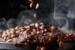 Steaming coffee beans in movement.