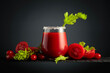 Fresh tomato juice in a glass with a celery stick and a heap of ripe vegetables on a black background.
