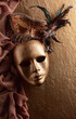 Vintage Venetian carnival masks masks on a golden background.