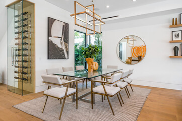 Wall Mural - a room with some glass tables and chairs on a rug