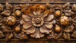 Elaborate wooden carving depicting a symmetrical floral motif with fine lines and aged patina.