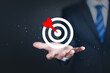 Target concept with Businessman hand holding target icon.