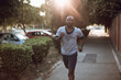 © Geber86 - Active young black man jogging on the street