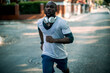 © Geber86 - Active young black man jogging on the street
