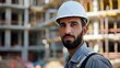 © Anastasiia - Portrait of male builder in white helmet against construction site. Concept Construction Worker Portraits, Male Builder Photoshoot, Businessman at Construction Site, Industrial Portrait