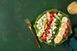 healthy American Cobb salad with egg bacon avocado chicken tomato. hearty keto low carb diet