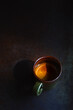 An espresso coffee shot on rustic table background.